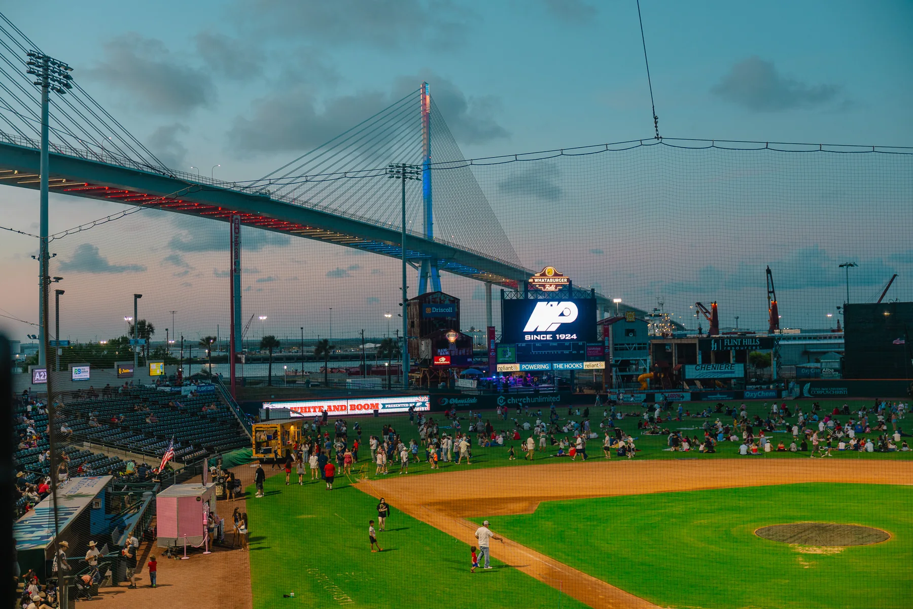 Baseball game and community event beneath the Harbor Bridge