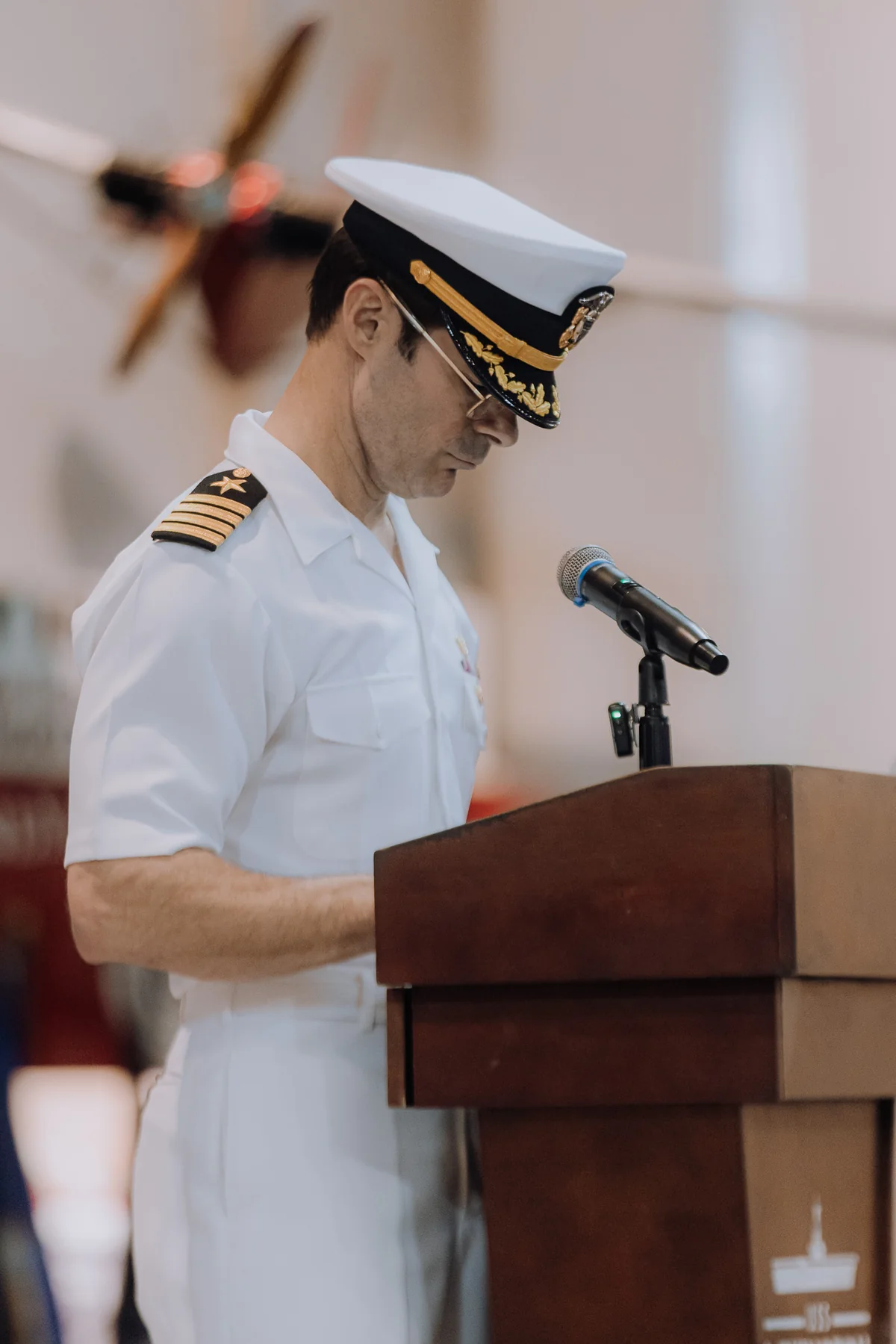 Naval officer speaking at a ceremony